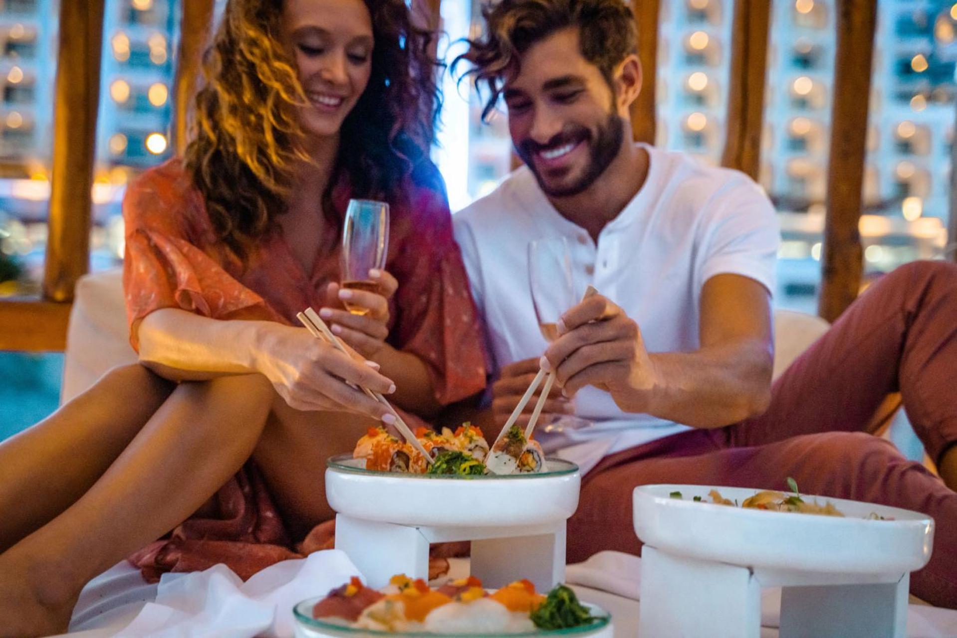 Mitsis Selection Alila Hotel Faliraki Bagian luar foto A couple eating at a restaurant