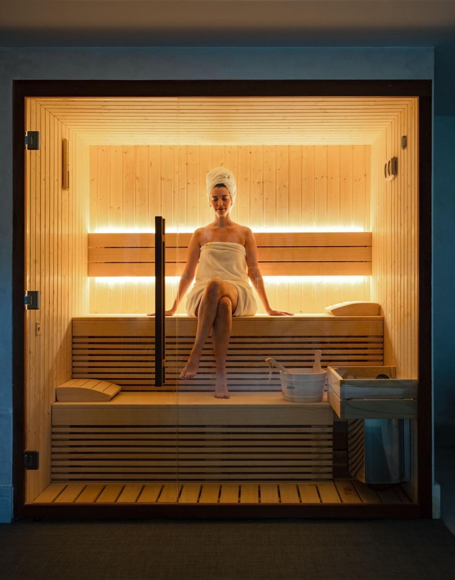 Mitsis Selection Alila Hotel Faliraki Bagian luar foto A woman in a sauna